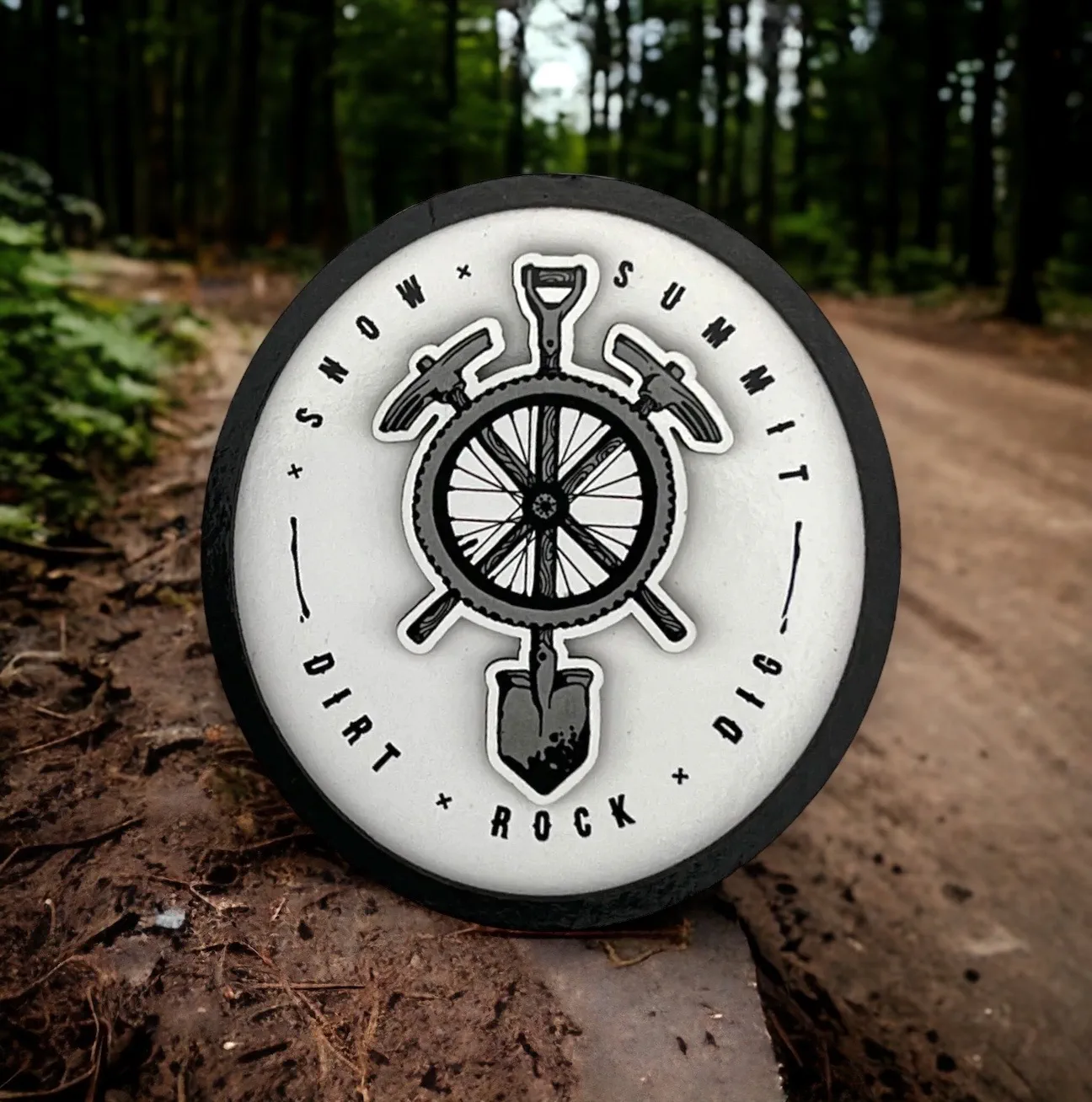 Snow summit's bike park digger logo on a magnet, black and white